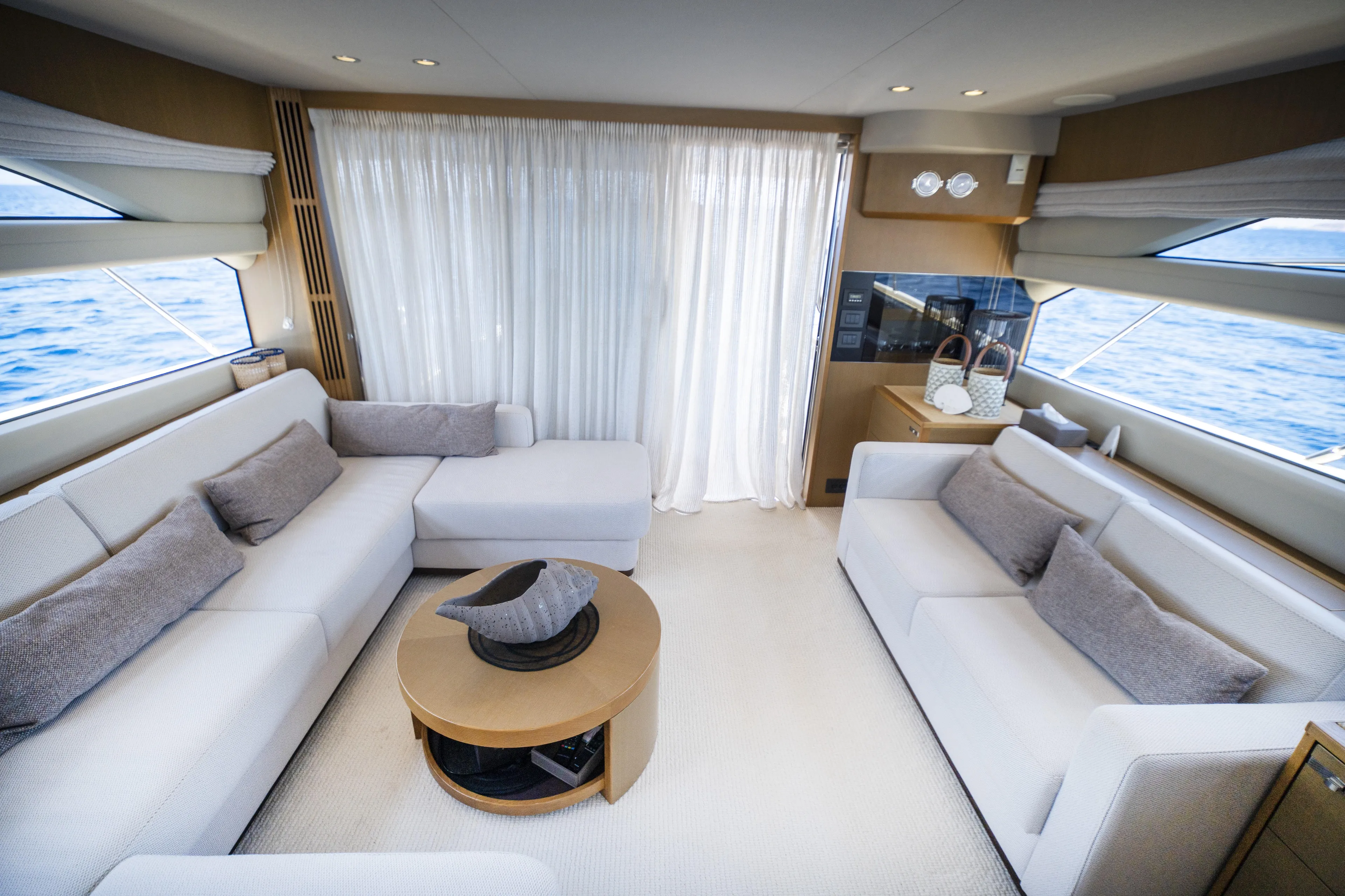  Yacht Photos Pics Luxurious interior of a 2014 Princess 56 yacht with elegant white sofas and ocean view.