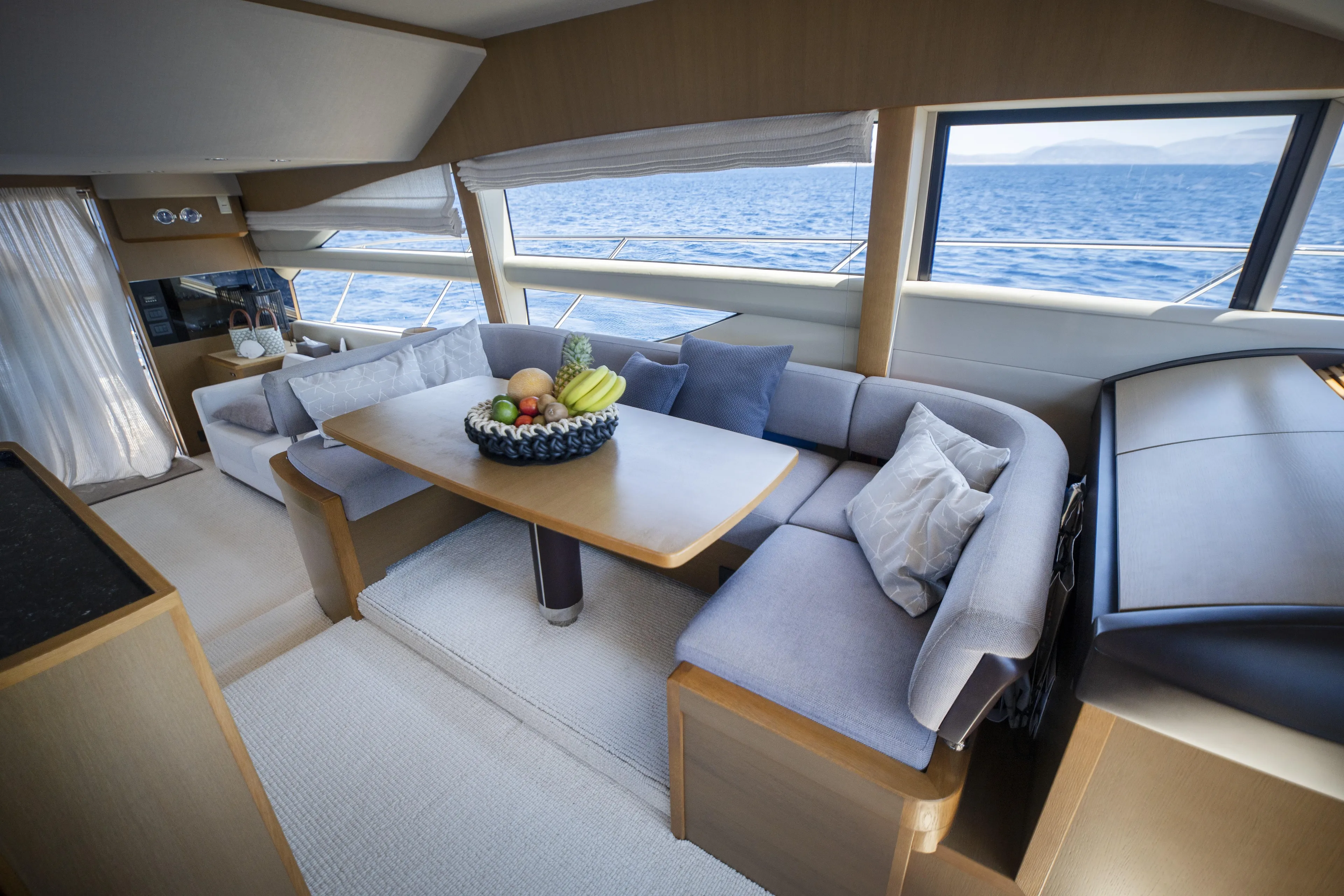 Yacht Photos Pics Luxurious interior of 2014 Princess 56 yacht with elegant seating and ocean view.
