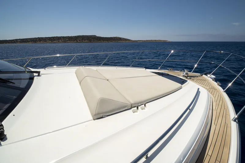  Yacht Photos Pics Luxury Princess 56 yacht deck, 2014 model, cruising on open sea under clear skies.