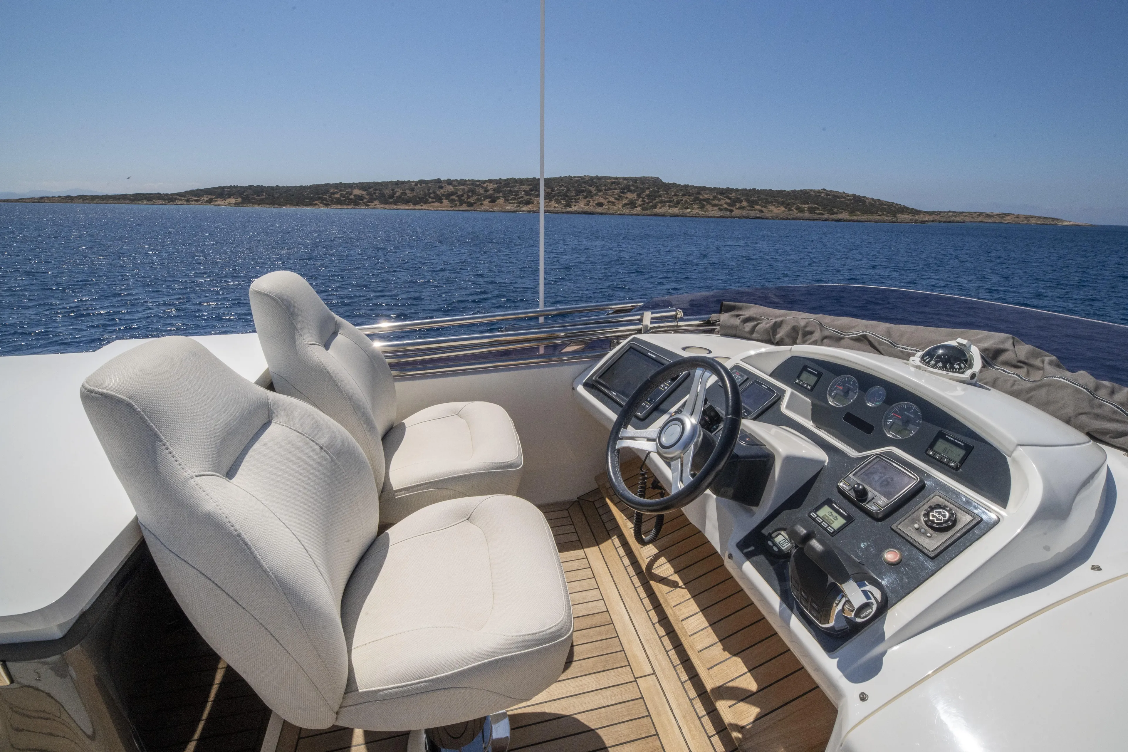  Yacht Photos Pics Luxury yacht helm with dual seats, Princess 56 model, 2014, overlooking serene ocean view.