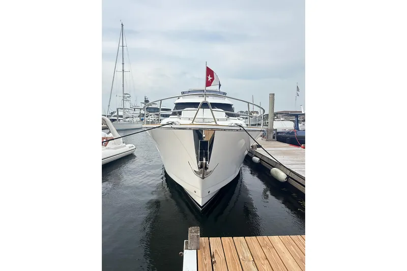 Habibi Yacht Photos Pics 2017 Belize 54 Daybridge yacht docked at marina, front view with flag.
