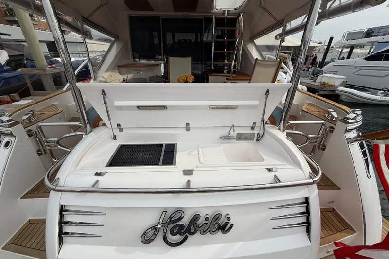 Habibi Yacht Photos Pics 2017 Belize 54 Daybridge yacht with outdoor sink and grill, docked at marina.