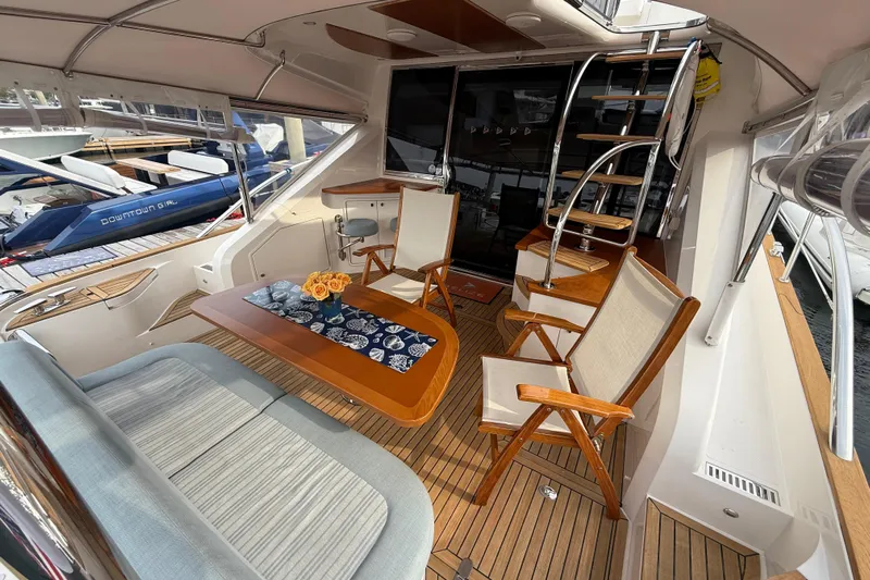 Habibi Yacht Photos Pics Luxurious 2017 Belize 54 Daybridge yacht interior with elegant seating and wooden table.