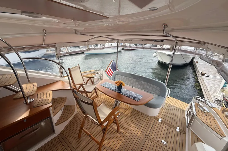 Habibi Yacht Photos Pics Luxurious 2017 Belize 54 Daybridge yacht interior with elegant seating and wooden deck.