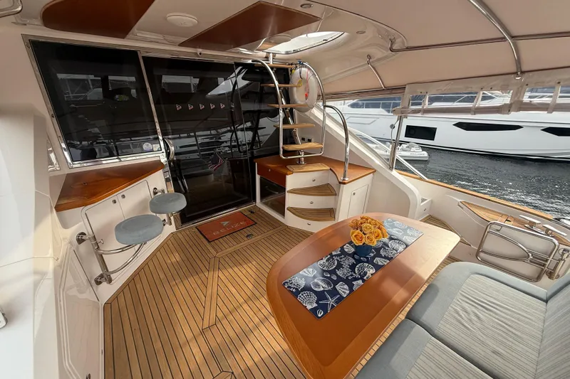 Habibi Yacht Photos Pics Luxurious interior of 2017 Belize 54 Daybridge yacht with elegant seating and wooden finishes.