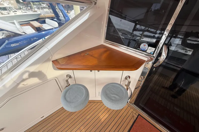 Habibi Yacht Photos Pics 2017 Belize 54 Daybridge yacht interior with wooden counter and two stools.