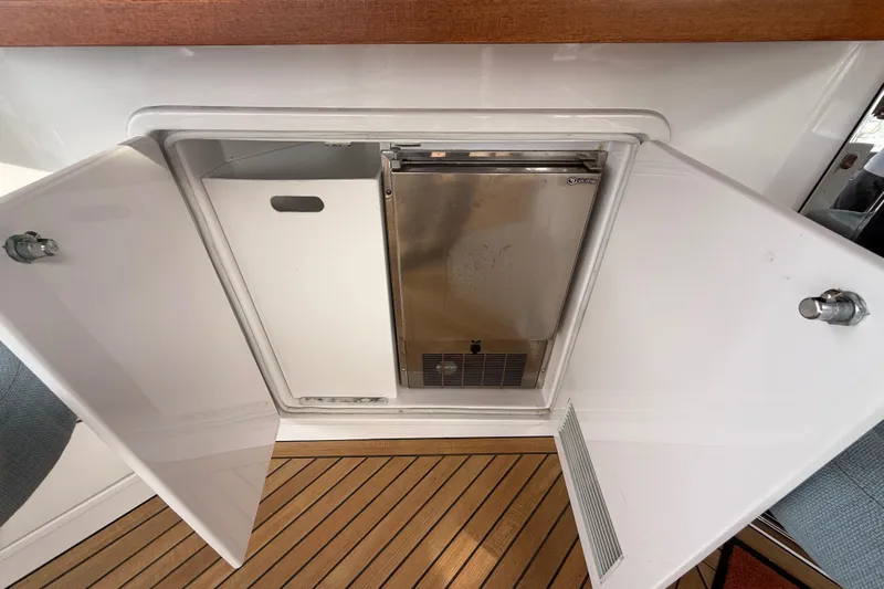 Habibi Yacht Photos Pics Open storage compartment on 2017 Belize 54 Daybridge yacht with stainless steel appliance.