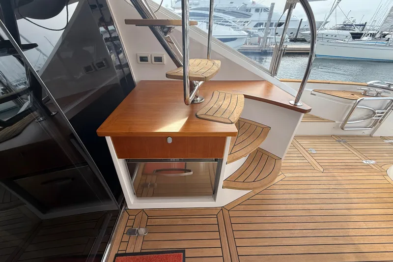 Habibi Yacht Photos Pics Elegant wooden staircase on 2017 Belize 54 Daybridge yacht with marina view.