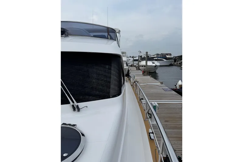 Habibi Yacht Photos Pics 2017 Belize 54 Daybridge yacht docked at marina, side view.
