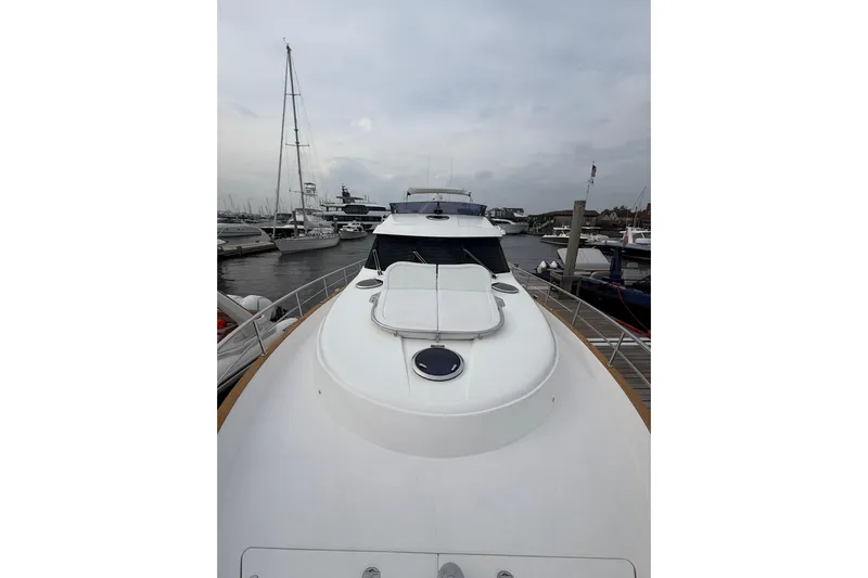 Habibi Yacht Photos Pics 2017 Belize 54 Daybridge yacht docked at marina, showcasing sleek design and spacious deck.