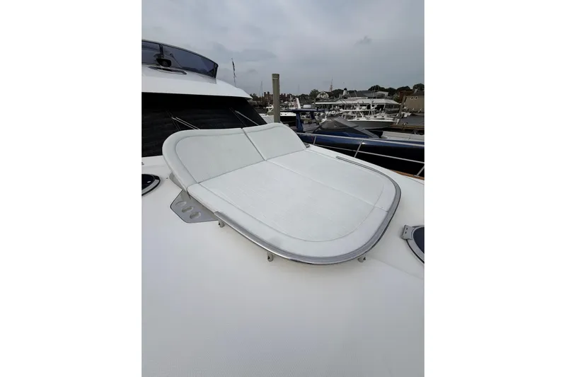 Habibi Yacht Photos Pics 2017 Belize 54 Daybridge yacht with sleek deck and sunbed, docked at marina.