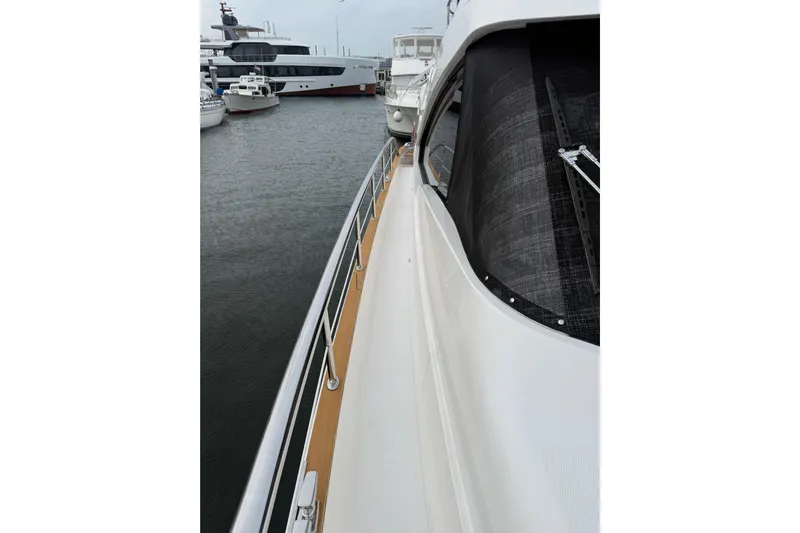 Habibi Yacht Photos Pics 2017 Belize 54 Daybridge yacht docked, showcasing sleek design and polished deck railing.