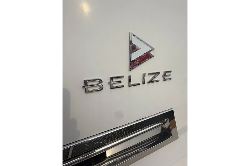 Habibi Yacht Photos Pics 2017 Belize 54 Daybridge logo on white surface, featuring chrome lettering and emblem.