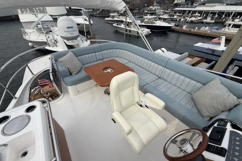 Habibi Yacht Photos Pics Luxurious 2017 Belize 54 Daybridge yacht with spacious seating and helm, docked at marina.