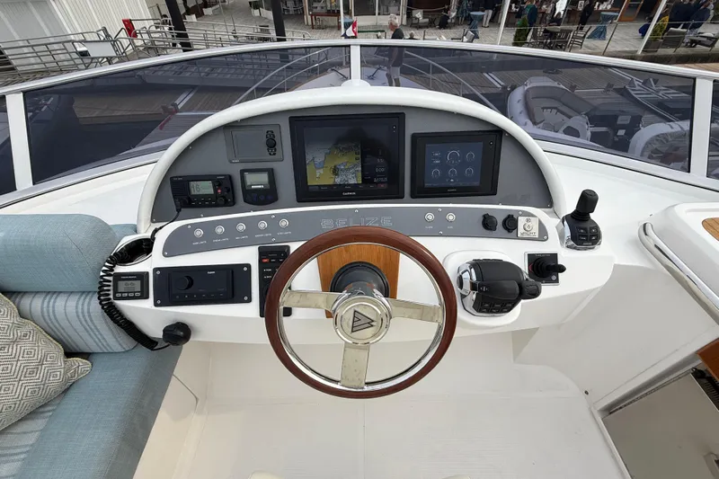 Habibi Yacht Photos Pics Helm of 2017 Belize 54 Daybridge yacht with modern navigation controls and steering wheel.