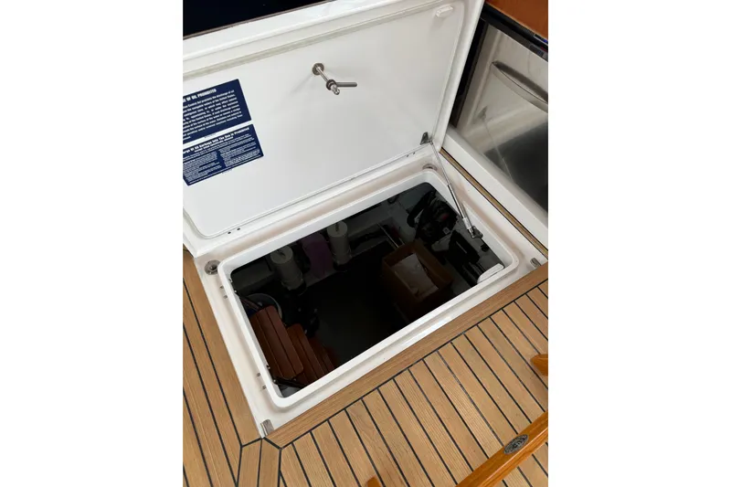 Habibi Yacht Photos Pics Open hatch on 2017 Belize 54 Daybridge yacht, revealing storage compartment.