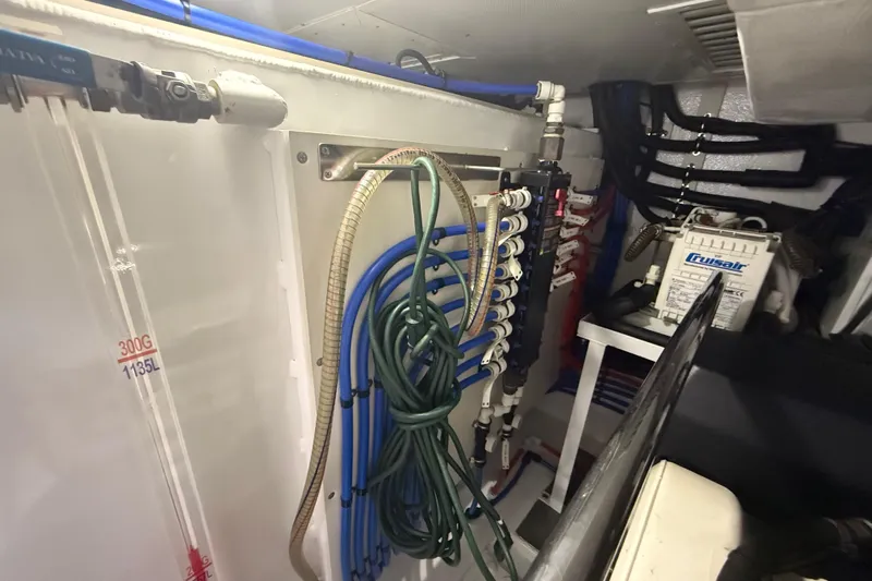 Habibi Yacht Photos Pics Engine room of 2017 Belize 54 Daybridge yacht with plumbing and equipment.