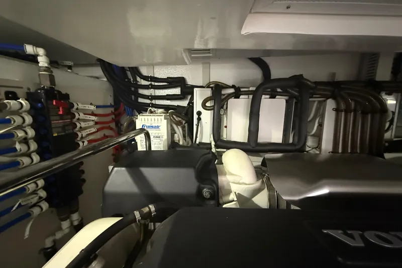 Habibi Yacht Photos Pics Engine room of 2017 Belize 54 Daybridge yacht with complex piping and machinery.