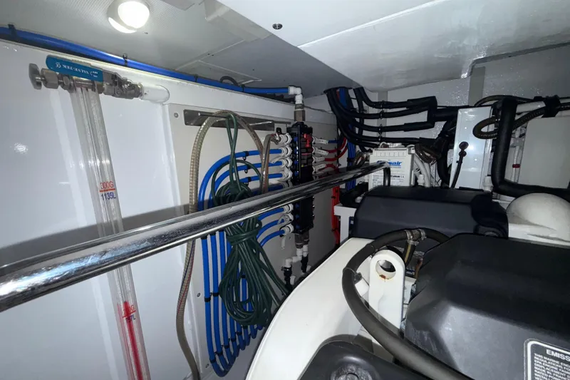Habibi Yacht Photos Pics Engine room of 2017 Belize 54 Daybridge yacht with complex piping and equipment.