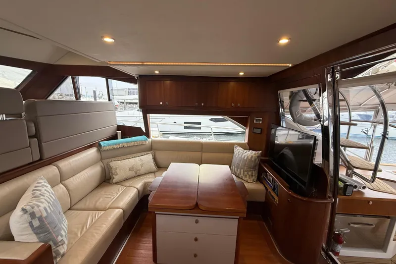 Habibi Yacht Photos Pics Luxurious interior of 2017 Belize 54 Daybridge yacht with leather seating and wooden accents.