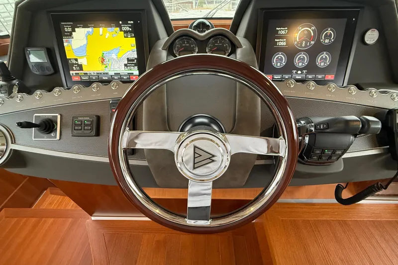 Habibi Yacht Photos Pics Steering wheel and dashboard of 2017 Belize 54 Daybridge yacht with navigation displays.