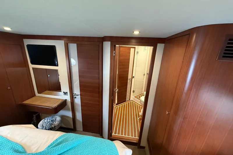 Habibi Yacht Photos Pics Luxurious interior of 2017 Belize 54 Daybridge yacht with wood finishes and modern amenities.