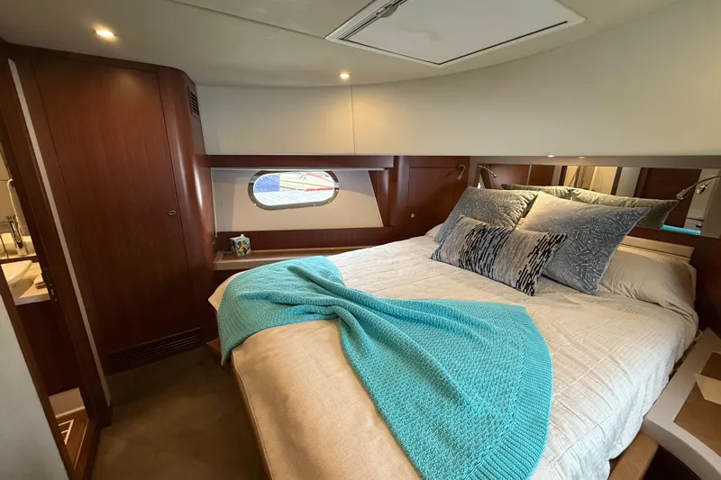 Habibi Yacht Photos Pics Luxurious bedroom interior of 2017 Belize 54 Daybridge yacht with cozy bedding and elegant decor.