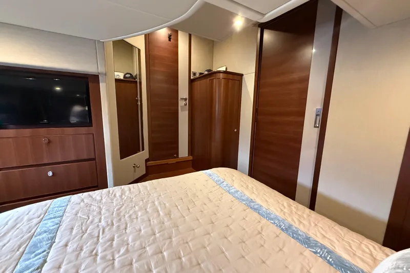 Habibi Yacht Photos Pics Luxurious cabin interior of 2017 Belize 54 Daybridge yacht with wood finishes and TV.