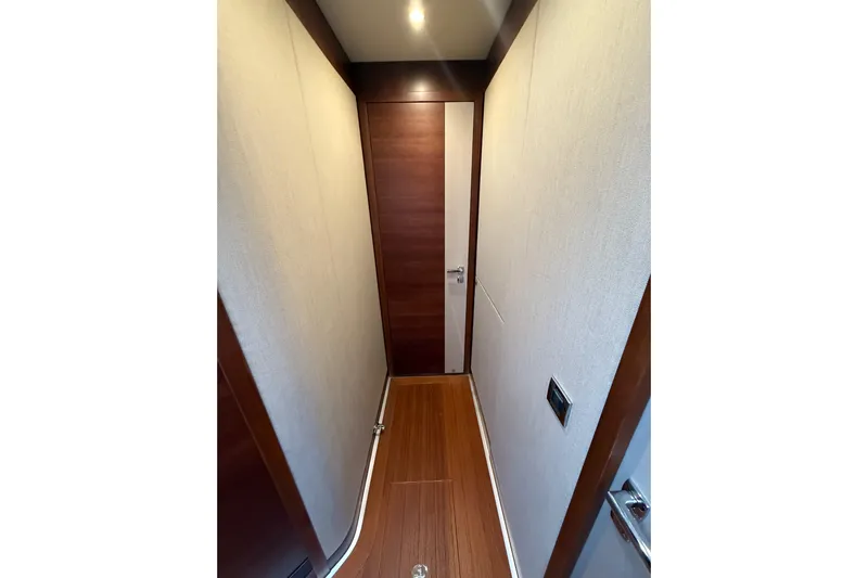 Habibi Yacht Photos Pics Narrow hallway inside 2017 Belize 54 Daybridge yacht with wooden flooring and modern design.