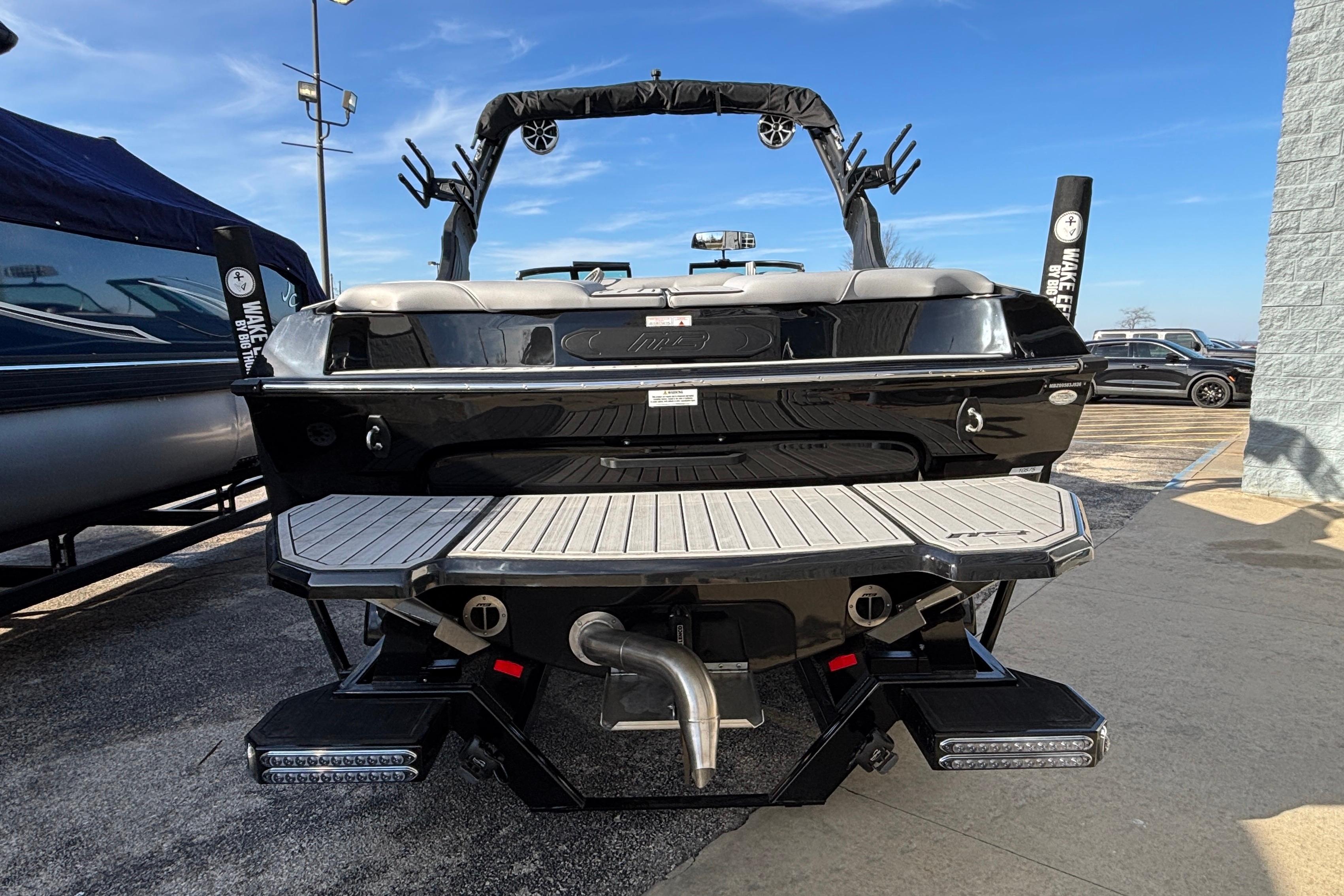 2026 MB B52 23 Classic boat, rear view, showcasing sleek design and swim platform.