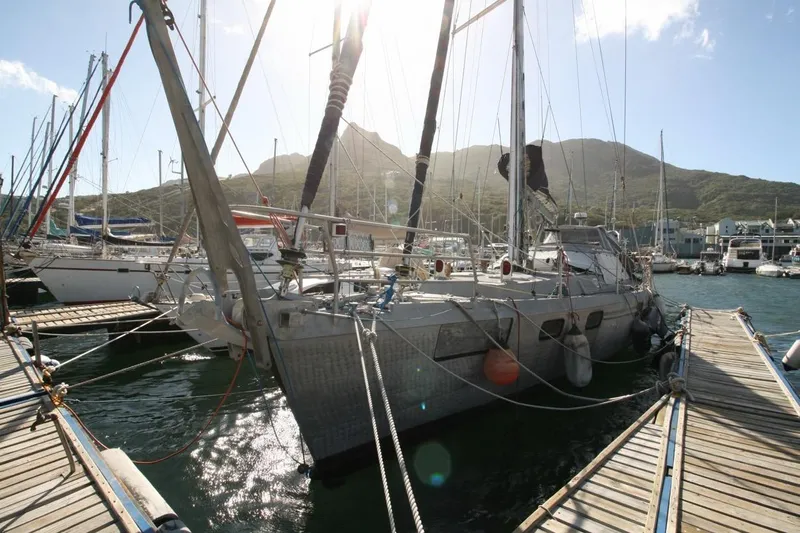 Espresso Yacht Photos Pics Sailboat docked at marina, Custom Southwell Sovereign 51, 2019, with mountainous backdrop.