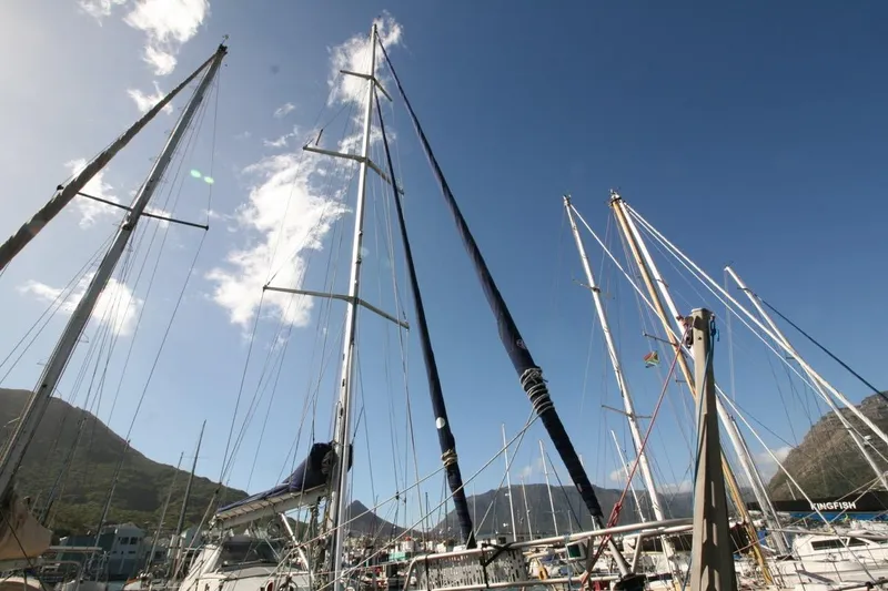 Espresso Yacht Photos Pics Sailboat masts against a clear blue sky, featuring the 2019 Southwell Sovereign 51.