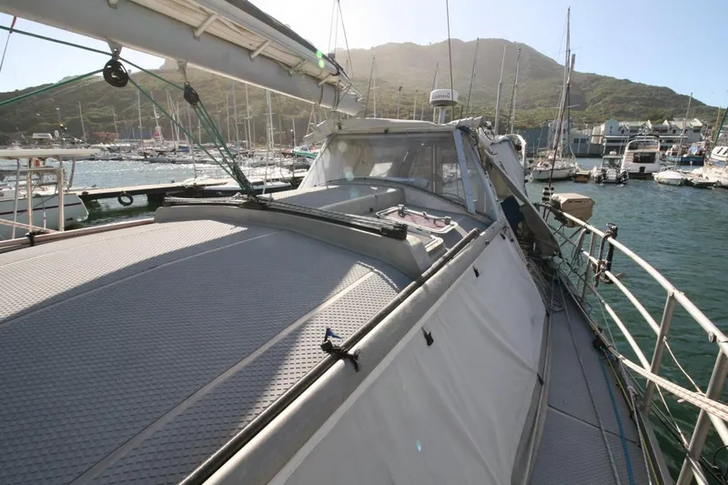 Espresso Yacht Photos Pics Sailing yacht Southwell Sovereign 51, 2019 model, docked in a marina with scenic mountain backdrop.