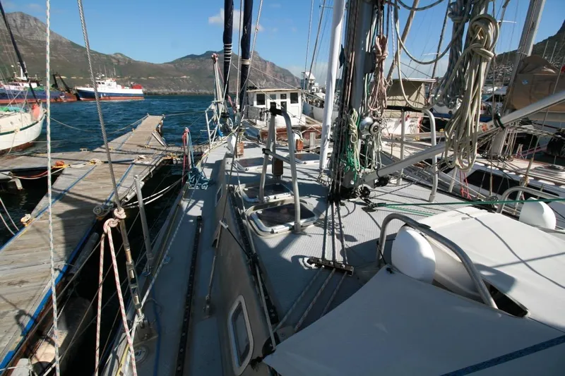 Espresso Yacht Photos Pics Sailboat docked at marina, Custom Southwell Sovereign 51, 2019 model, with scenic mountain backdrop.