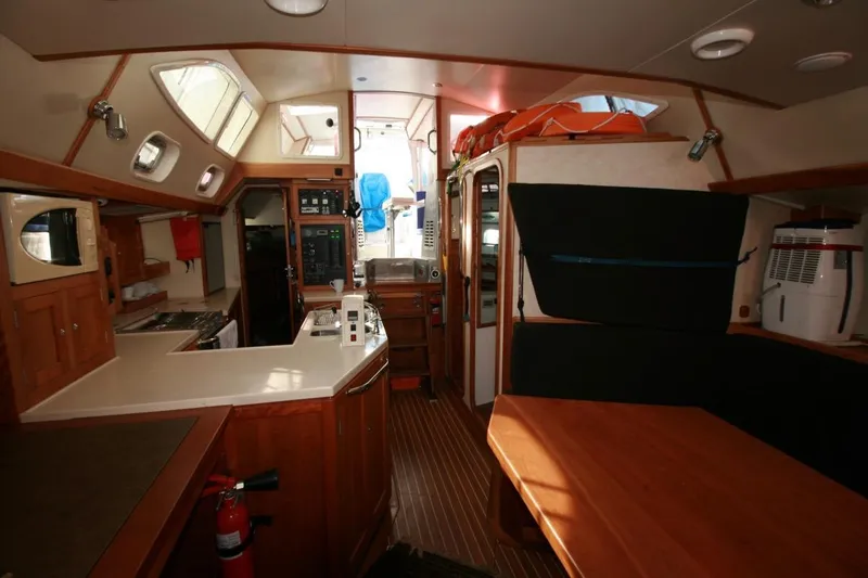 Espresso Yacht Photos Pics Interior of 2019 Custom Southwell Sovereign 51 yacht with kitchen and seating area.