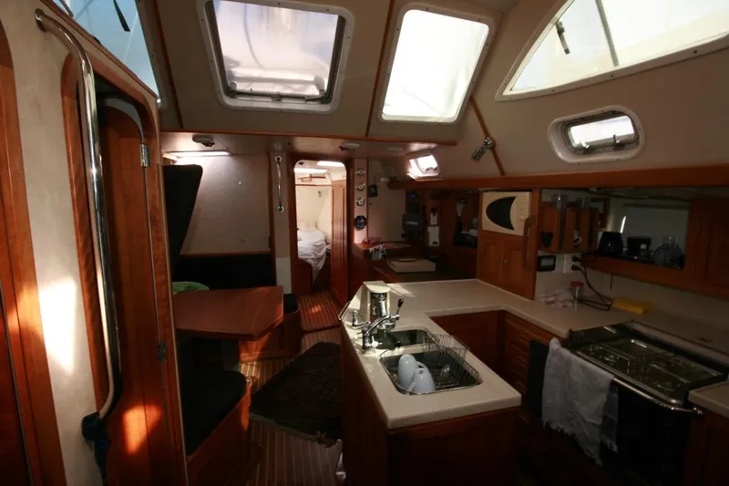 Espresso Yacht Photos Pics Luxurious interior of 2019 Custom Southwell Sovereign 51 yacht with modern kitchen and dining area.
