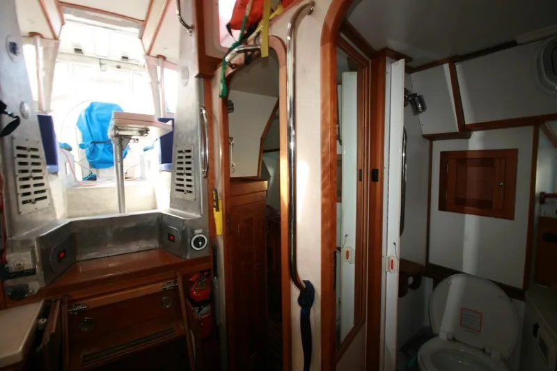 Espresso Yacht Photos Pics Interior of 2019 Custom Southwell Sovereign 51 yacht, featuring a compact bathroom and seating area.