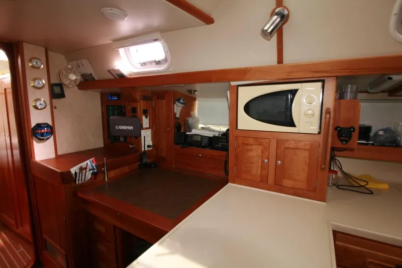 Espresso Yacht Photos Pics Interior of 2019 Southwell Sovereign 51 yacht with wooden cabinetry and modern appliances.