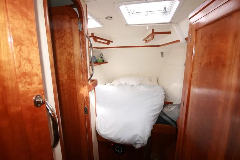 Espresso Yacht Photos Pics Cozy cabin interior of 2019 Southwell Sovereign 51 yacht with wooden finish and skylight.