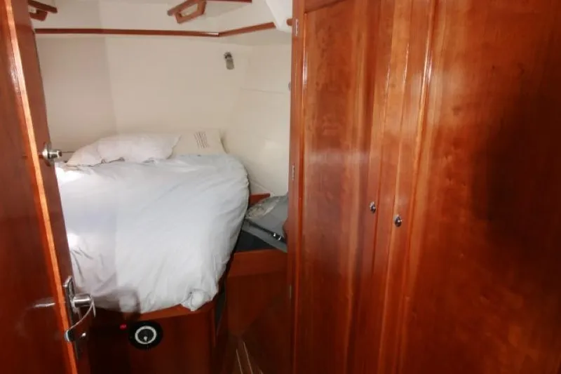 Espresso Yacht Photos Pics Cozy cabin interior of 2019 Custom Southwell Sovereign 51 yacht with wooden finishes.