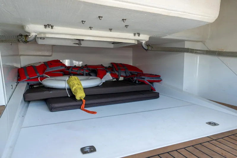  Yacht Photos Pics Storage compartment on 2022 Galeon 425 HTS yacht with life jackets and safety equipment.
