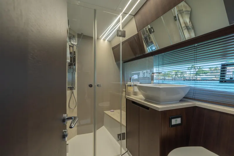  Yacht Photos Pics Luxurious bathroom interior of 2022 Galeon 425 HTS yacht with modern fixtures and glass shower.