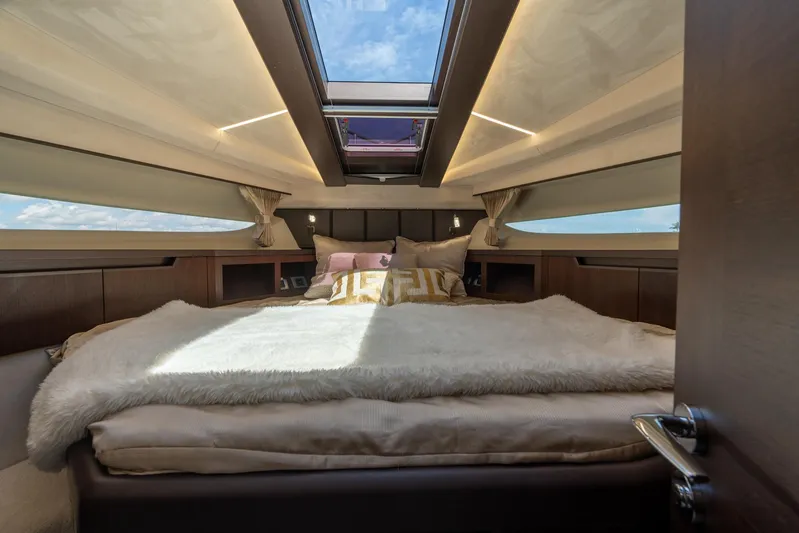  Yacht Photos Pics Luxurious interior of 2022 Galeon 425 HTS yacht with skylight and plush bedding.