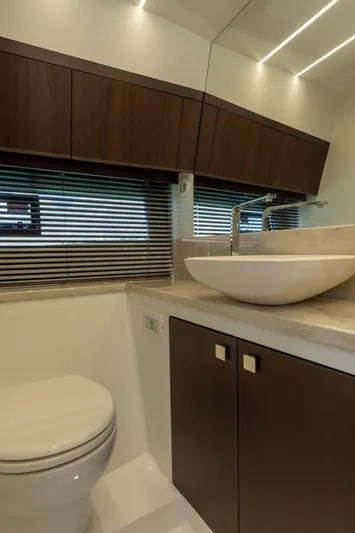  Yacht Photos Pics Modern bathroom interior of 2022 Galeon 425 HTS yacht with sleek fixtures and wood accents.