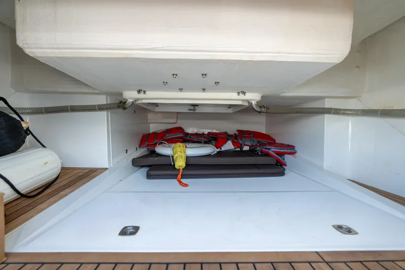  Yacht Photos Pics Storage compartment in 2022 Galeon 425 HTS yacht with life jackets and equipment.