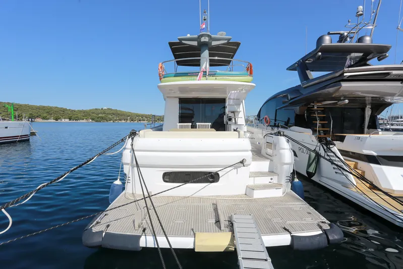  Yacht Photos Pics 2019 Azimut Magellano 53 yacht docked at marina, rear view.