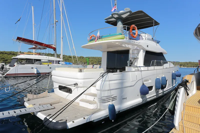  Yacht Photos Pics 2019 Azimut Magellano 53 yacht docked at marina, clear blue sky background.