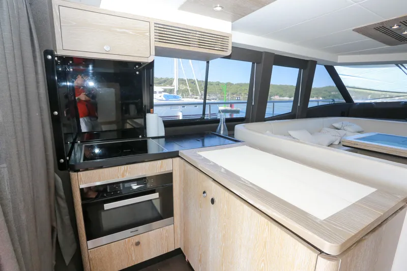  Yacht Photos Pics Modern kitchen interior on 2019 Azimut Magellano 53 yacht with scenic window view.