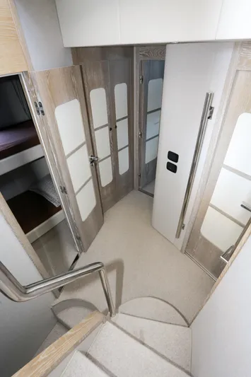  Yacht Photos Pics Interior hallway of 2019 Azimut Magellano 53 yacht with modern design and wooden doors.