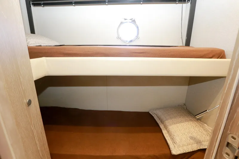  Yacht Photos Pics Bunk beds in 2019 Azimut Magellano 53 yacht cabin with porthole window.